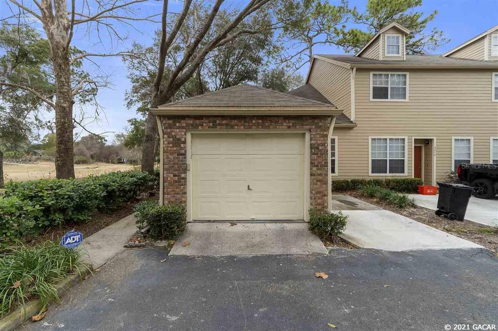 5218 Southwest 97 Way Gainesville, FL 32608 - Photo 1 of 1 a front view of a house with garden