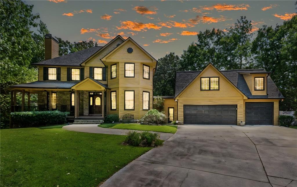 190 Rose Ridge Drive Canton, GA 30115 - Photo 1 of 1 a front view of a house with a yard and garage