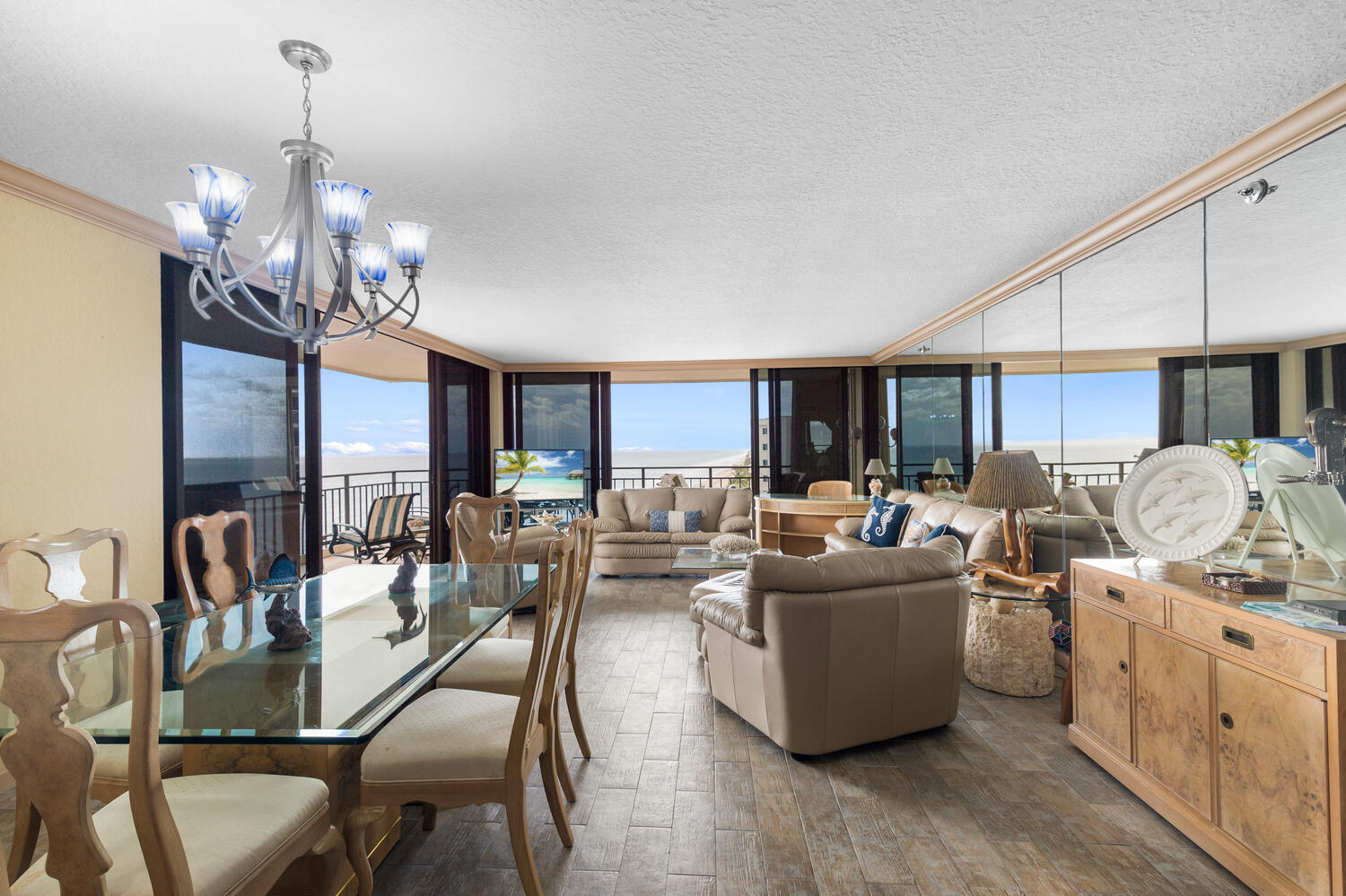 3009 South Ocean Boulevard, Unit 901 Highland Beach, FL 33487 - Photo 16 of 44 a living room with lots of furniture and chandelier