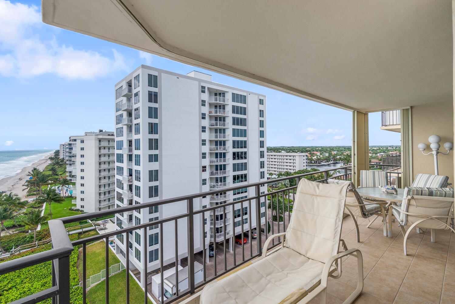 3009 South Ocean Boulevard, Unit 901 Highland Beach, FL 33487 - Photo 25 of 44 a balcony with furniture and city view