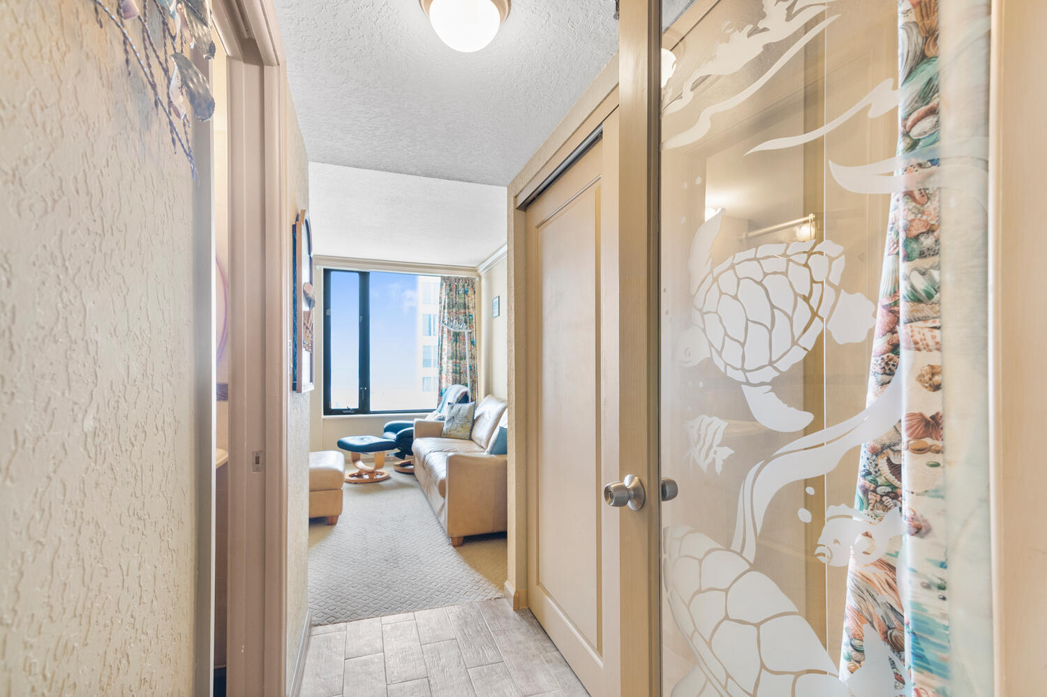 3009 South Ocean Boulevard, Unit 901 Highland Beach, FL 33487 - Photo 6 of 44 a view of a hallway with wooden floor and a living room