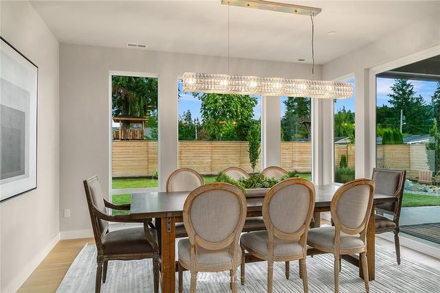 a bedroom with bed couches and flat screen tv