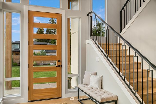 a view of bedroom with furniture and windows
