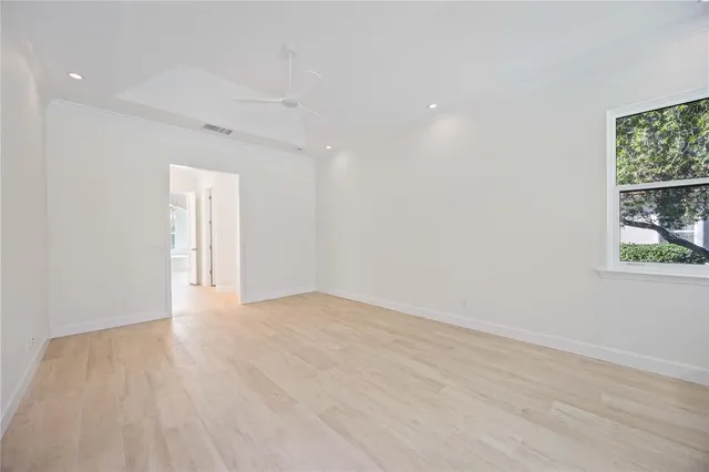 a view of a walk in closet and a window