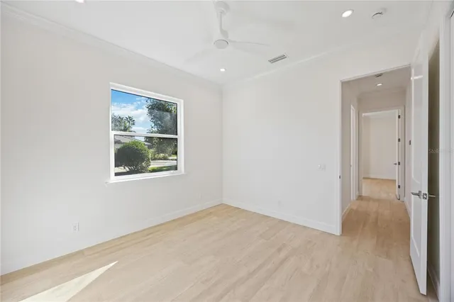 a spacious bathroom with a double vanity sink a mirror and a