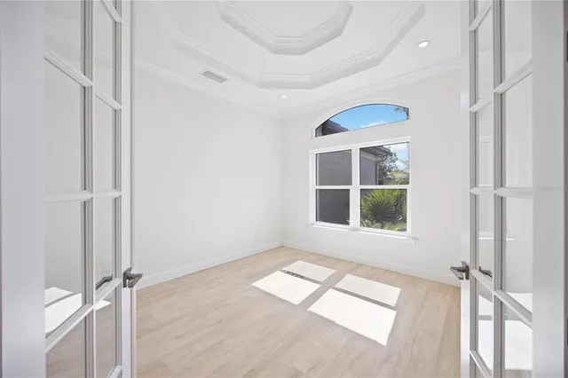 a view of an entryway with wooden floor
