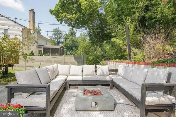 a view of the patio with couches and a table