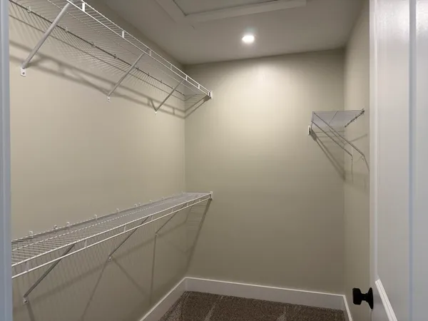 a view of a room with racks on the wall
