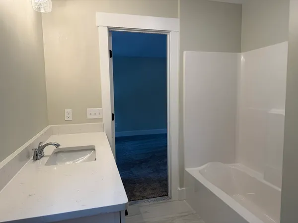 a bathroom with a sink and a tub