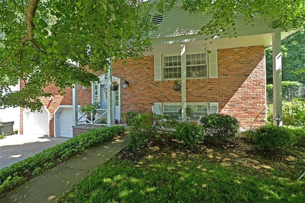 9372 Hilliard Road Pittsburgh, PA 15237 - Photo 2 of 24 Mature plantings and trees accentuate the covered porch.