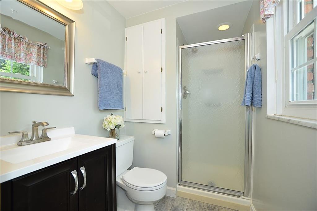 9372 Hilliard Road Pittsburgh, PA 15237 - Photo 11 of 24 Private master bath has been refreshed with ceramic tile, neutral paint, new vanity and mirror.