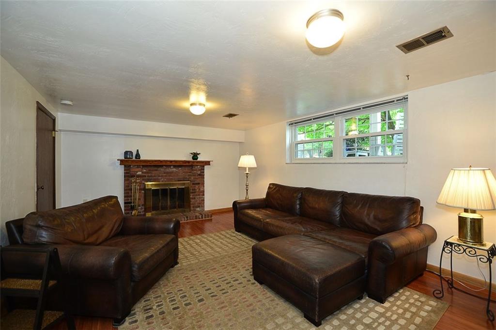 9372 Hilliard Road Pittsburgh, PA 15237 - Photo 15 of 24 13*20 family room with fireplace.