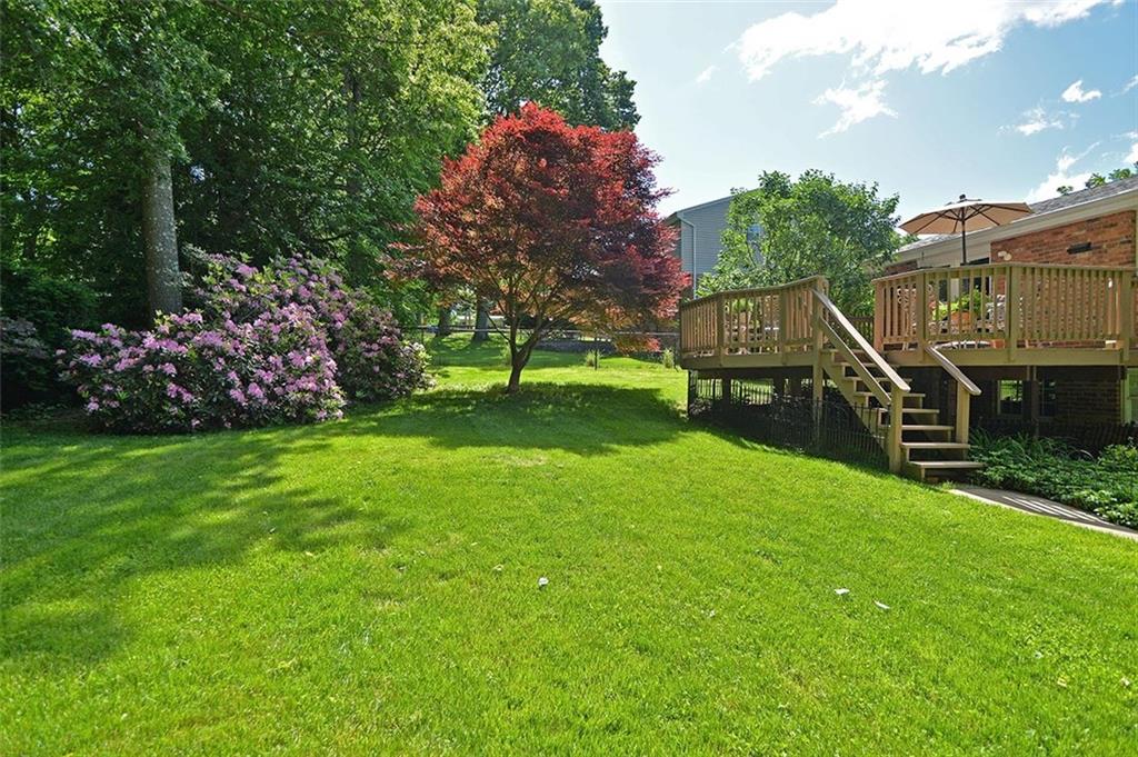 9372 Hilliard Road Pittsburgh, PA 15237 - Photo 23 of 24 Established blooming rhododendron and mature trees provide privacy in the rear yard.