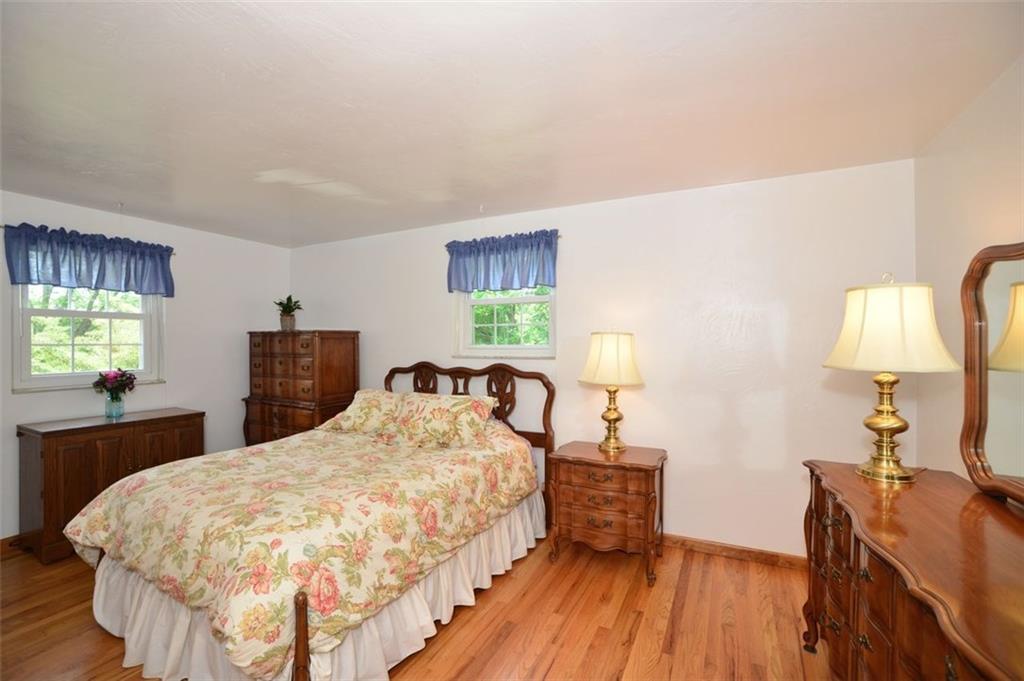9372 Hilliard Road Pittsburgh, PA 15237 - Photo 10 of 24 Master bedroom with private bath and hardwood floors.