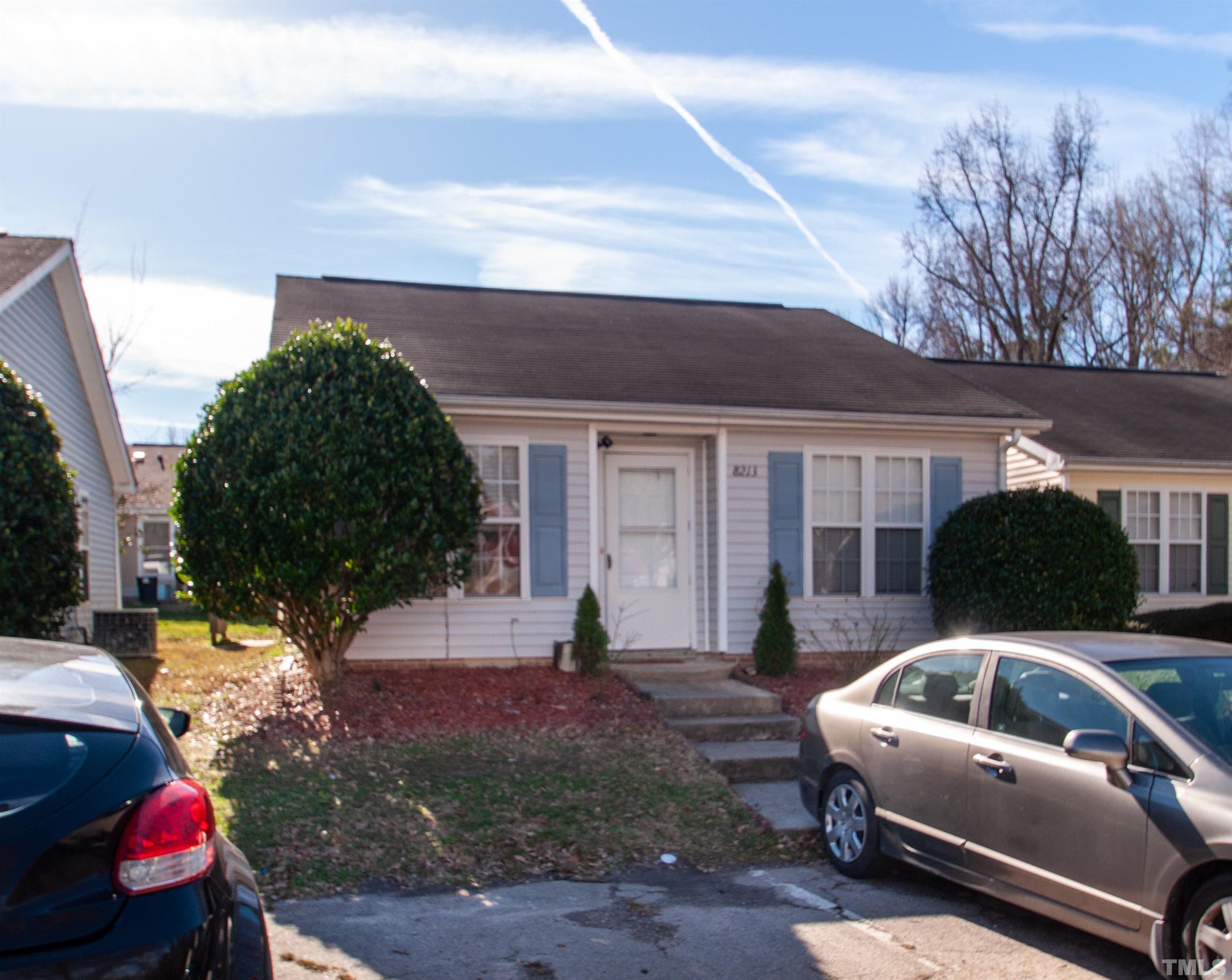8213 Merriweather Circle Raleigh, NC 27616 - Photo 1 of 23 a front view of a house with garden