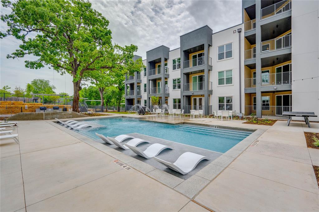 4801 Springdale Road, Unit 1307 Austin, TX 78723 - Photo 23 of 30 a swimming pool with outdoor seating and yard
