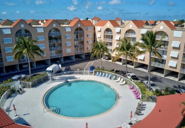 a view of swimming pool from a balcony