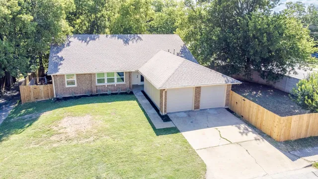 a view of house with outdoor space and swimming pool