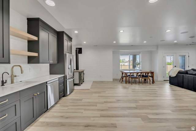 1720 Hillcrest Circle Mapleton, UT 84664 - Photo 116 of 116 Kitchen with open shelves, open floor plan, stainless steel appliances, light wood finished floors, and decorative backsplash