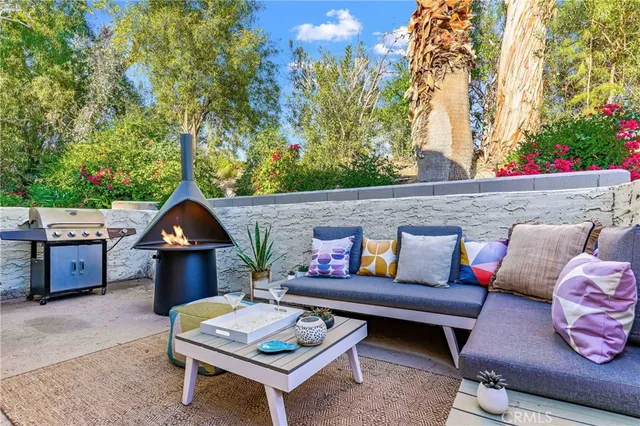 a outdoor living space with furniture and a potted plant