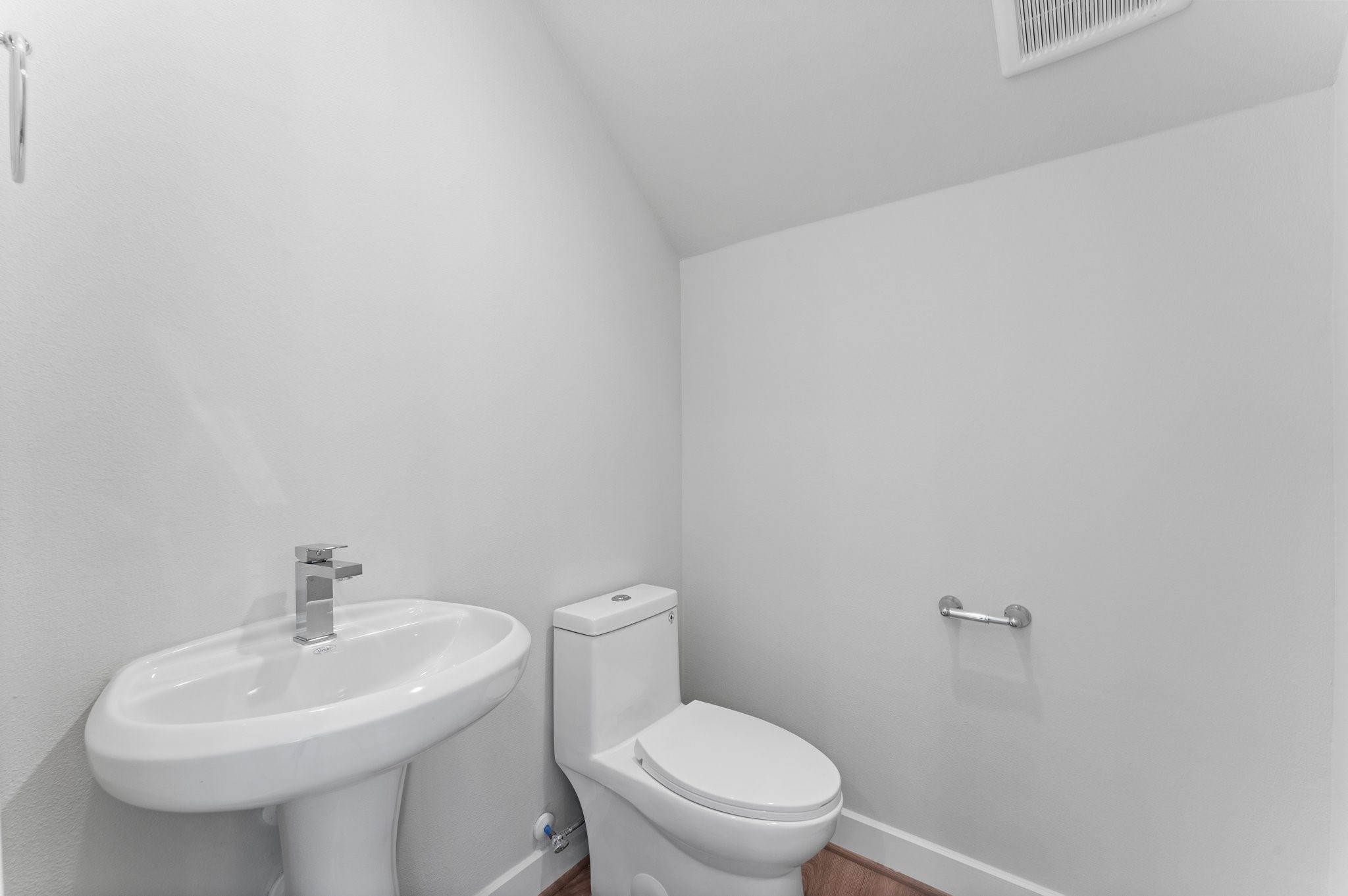 5904 Jasper Jones Way Houston, TX 77091 - Photo 11 of 37 a white toilet sitting next to a white sink