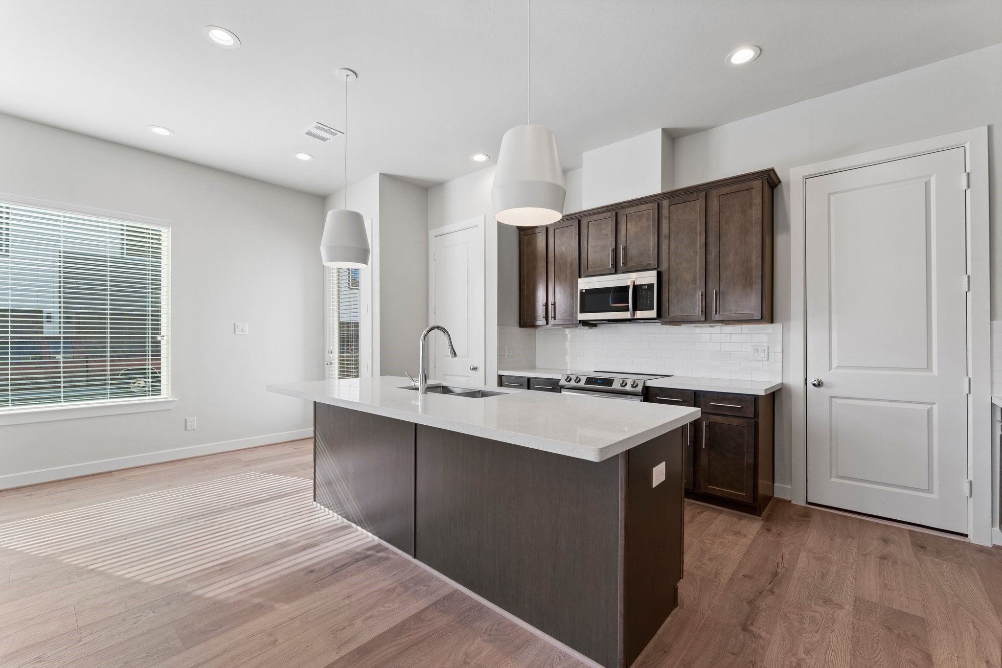 5904 Jasper Jones Way Houston, TX 77091 - Photo 7 of 37 a kitchen with stainless steel appliances a sink stove and refrigerator