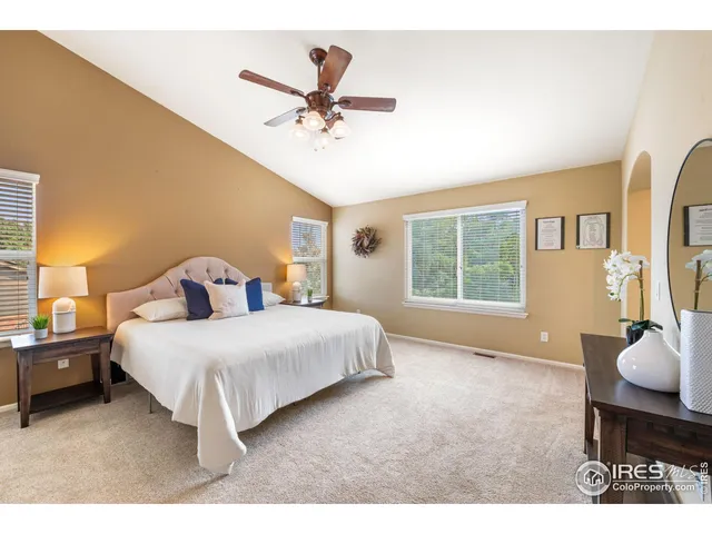 a living room with a bed furniture and a window