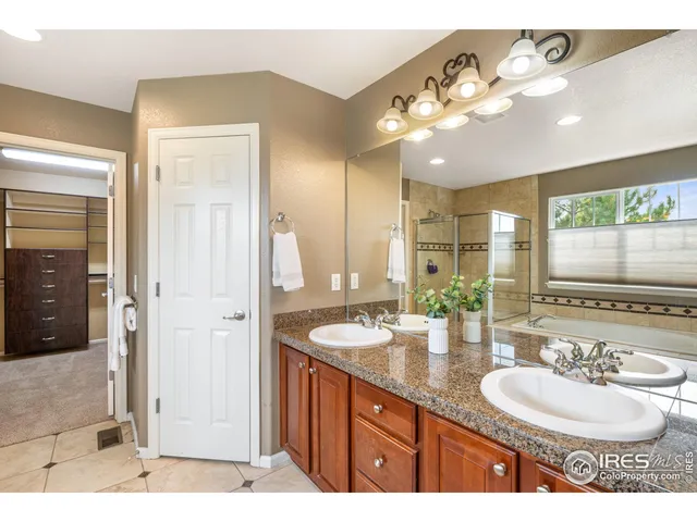 a bathroom with a sink double vanity and a mirror
