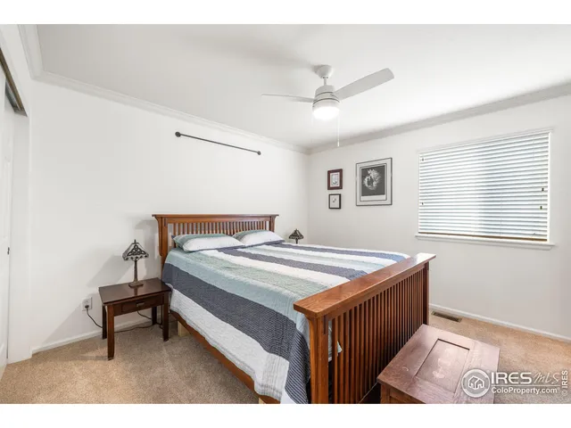 a bedroom with a bed and a table in it