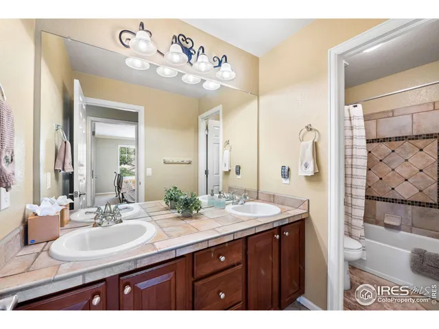 a bathroom with a sink a mirror and a shower