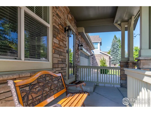a view of a two chairs in the balcony