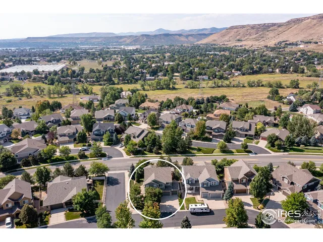 an aerial view of residential houses and outdoor space