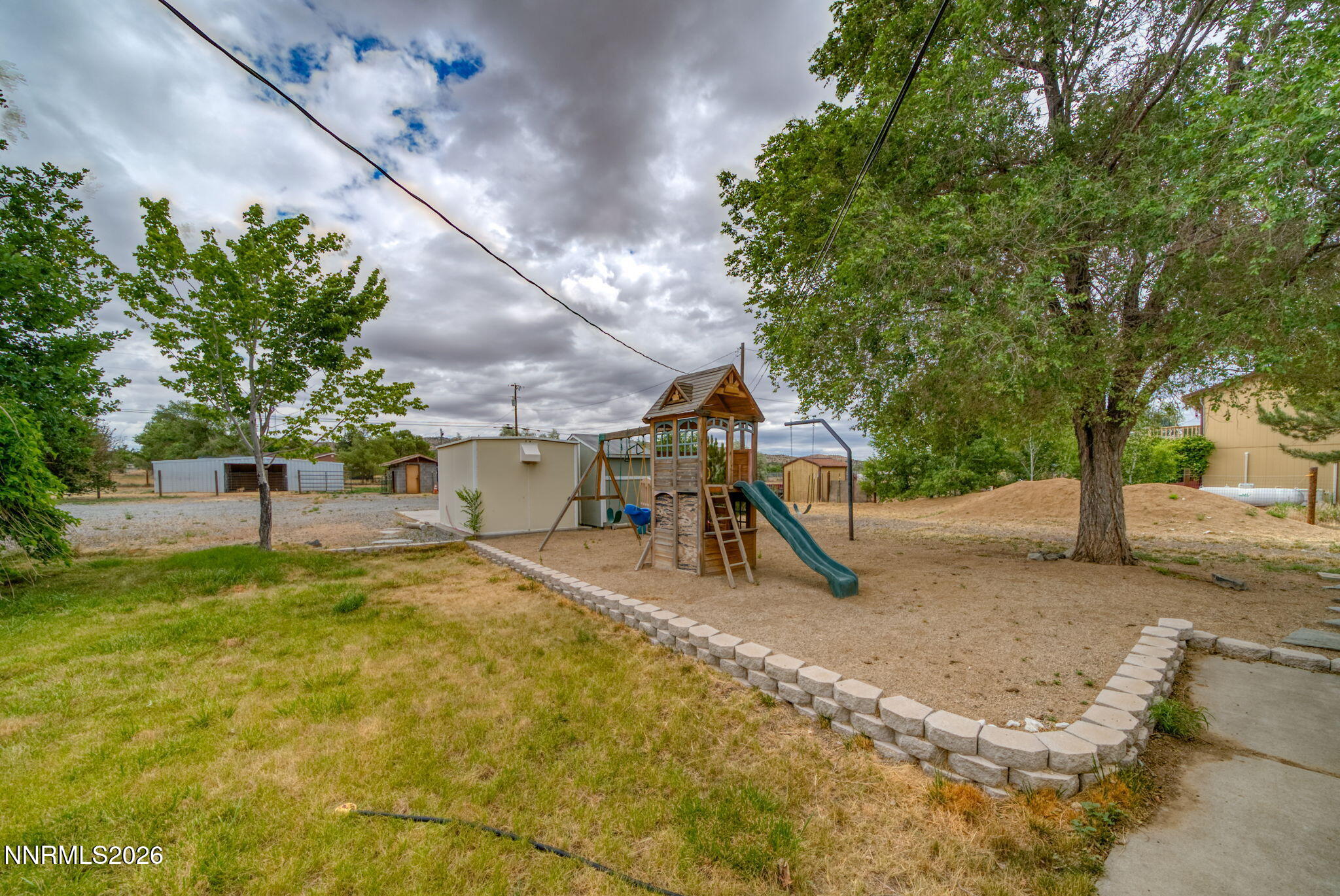 11577 Deodar Way Reno, NV 89506 - Photo 44 of 58 a sign board with yard in the back