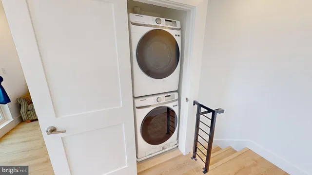a close view of a utility room with dryer and washer