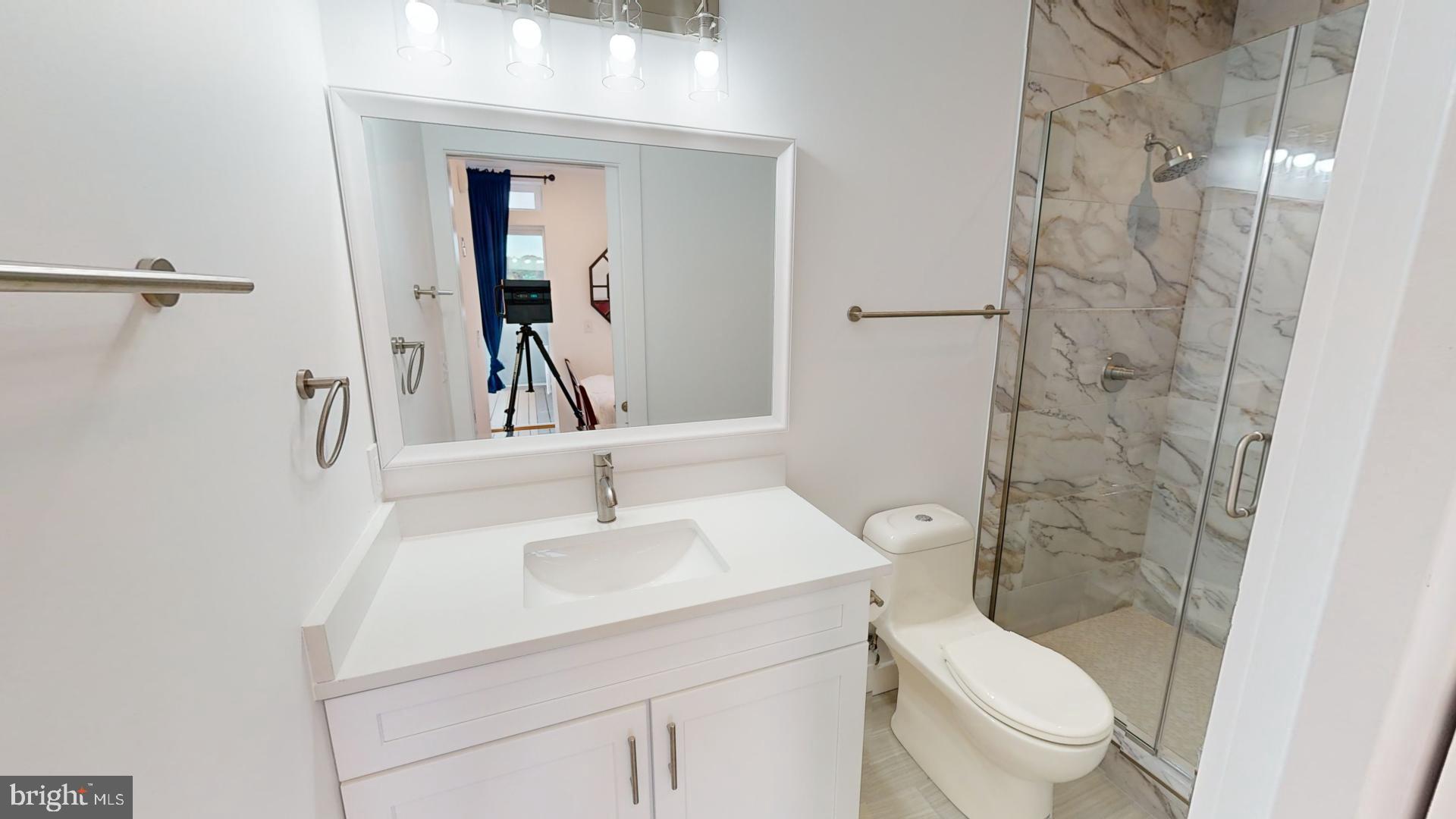 201 Kennedy Street Northwest, Unit 8 Washington, DC 20011 - Photo 10 of 14 a bathroom with a sink toilet and shower