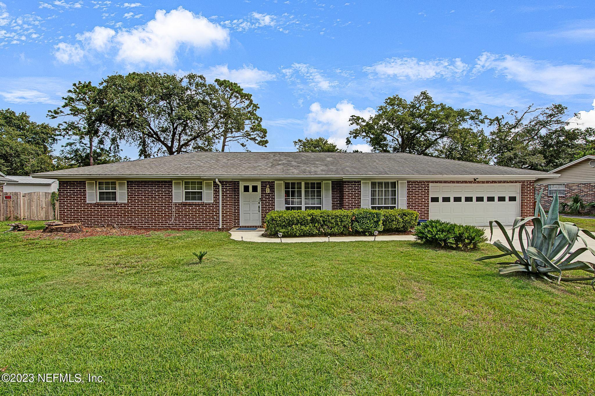 2411 Aquarius Road Orange Park, FL 32073 - Photo 2 of 24 a view of a house with a yard