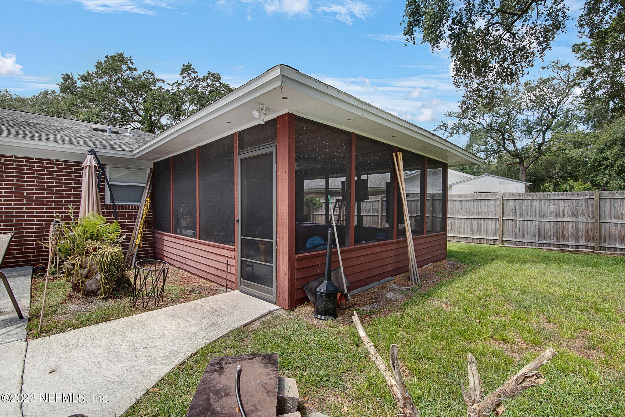2411 Aquarius Road Orange Park, FL 32073 - Photo 21 of 24 a front view of a house with garden