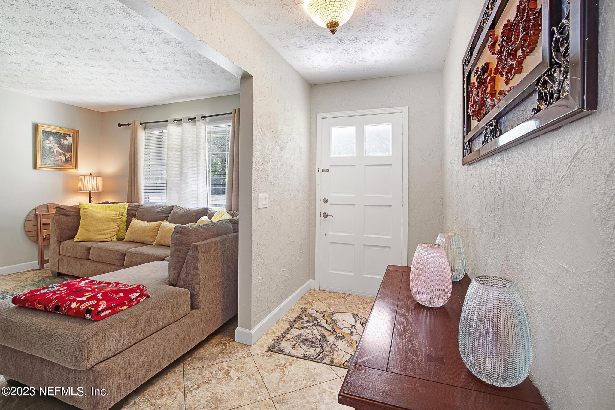 2411 Aquarius Road Orange Park, FL 32073 - Photo 4 of 24 a living room with furniture and wooden floor
