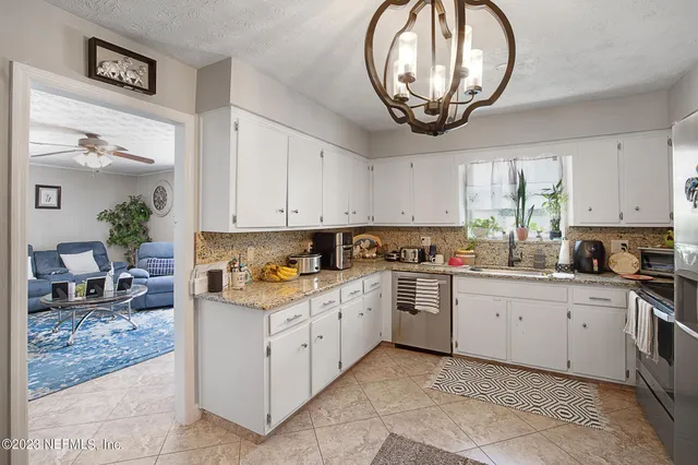 a kitchen with a cabinets and window