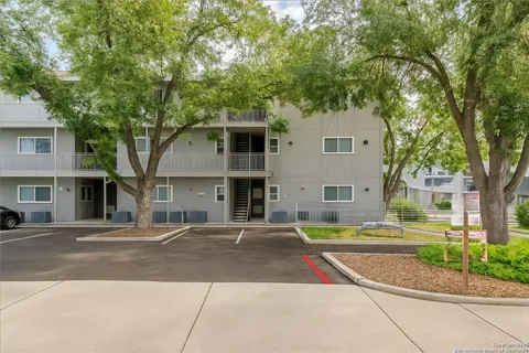 an aerial view of a house with a garden and swimming pool