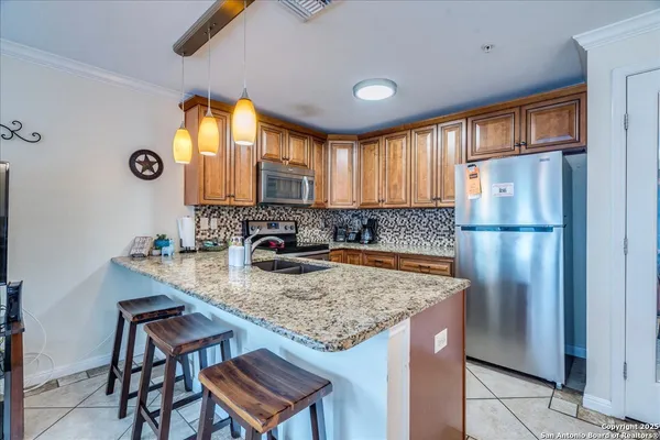 a kitchen with a refrigerator a sink and a refrigerator