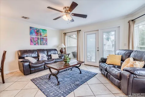 a living room with furniture and a rug