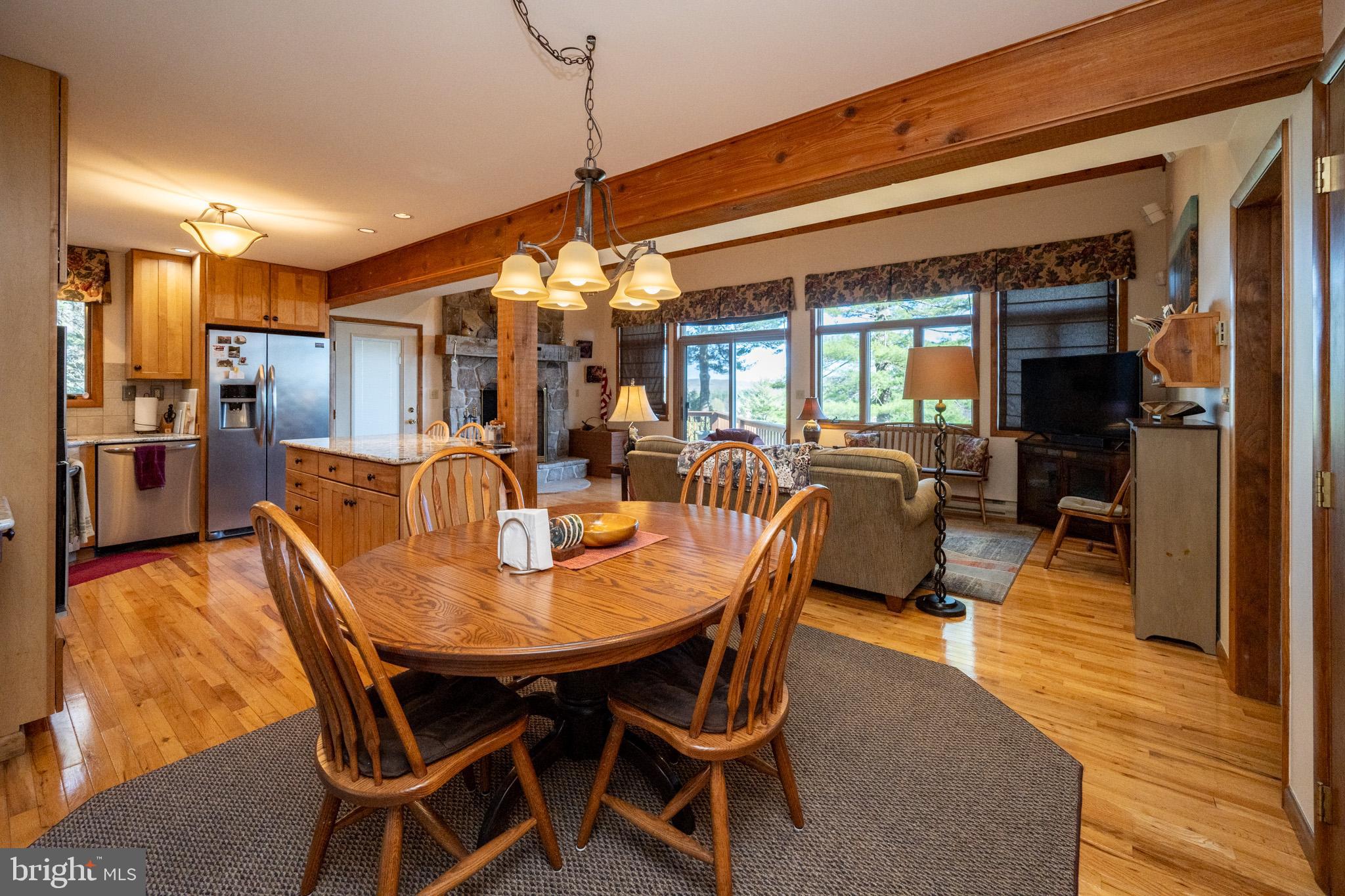 59 Glenview Road Swanton, MD 21561 - Photo 20 of 85 a view of a dining room with furniture window and wooden floor