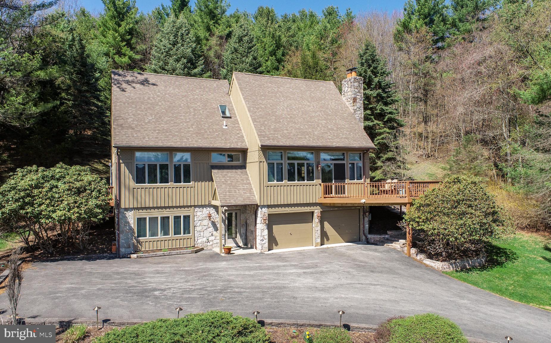 59 Glenview Road Swanton, MD 21561 - Photo 2 of 85 a aerial view of a house with a yard and potted plants