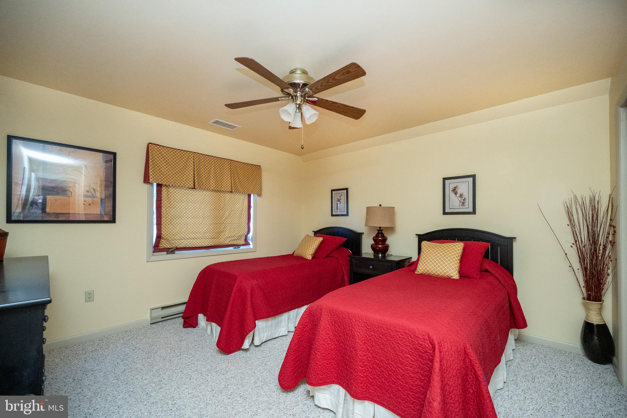 59 Glenview Road Swanton, MD 21561 - Photo 36 of 85 a bedroom with two beds and painting on the wall