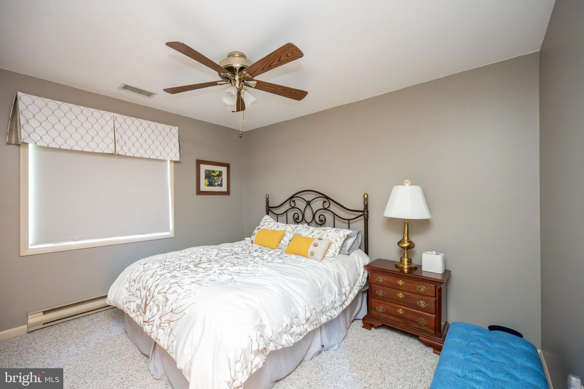 59 Glenview Road Swanton, MD 21561 - Photo 41 of 85 a bedroom with a bed and wooden floor