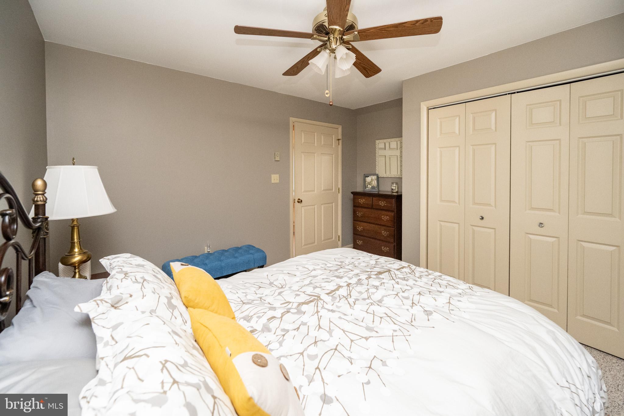 59 Glenview Road Swanton, MD 21561 - Photo 43 of 85 a bedroom with a bed and a lamp