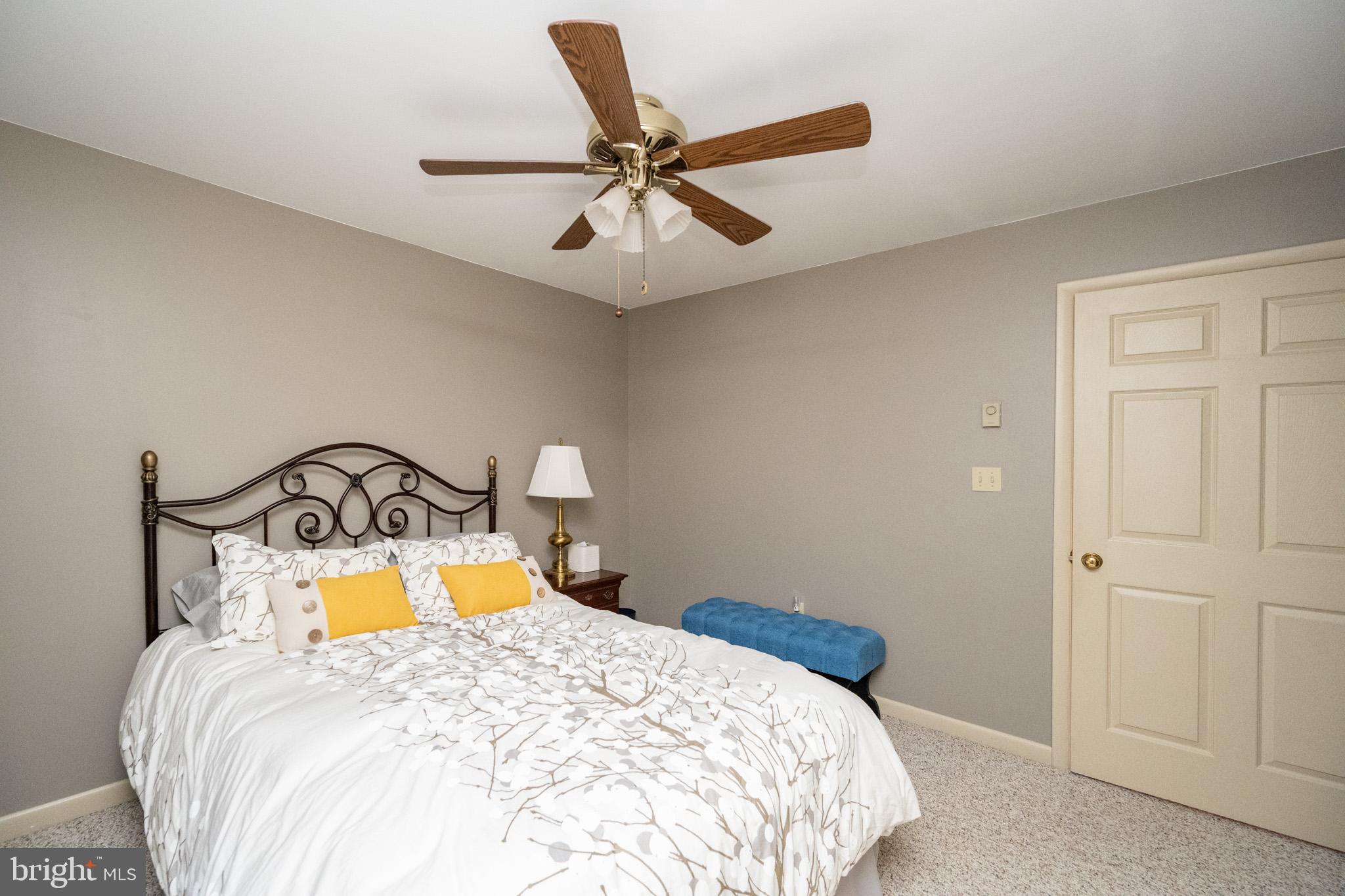 59 Glenview Road Swanton, MD 21561 - Photo 44 of 85 a bedroom with a bed and a ceiling fan