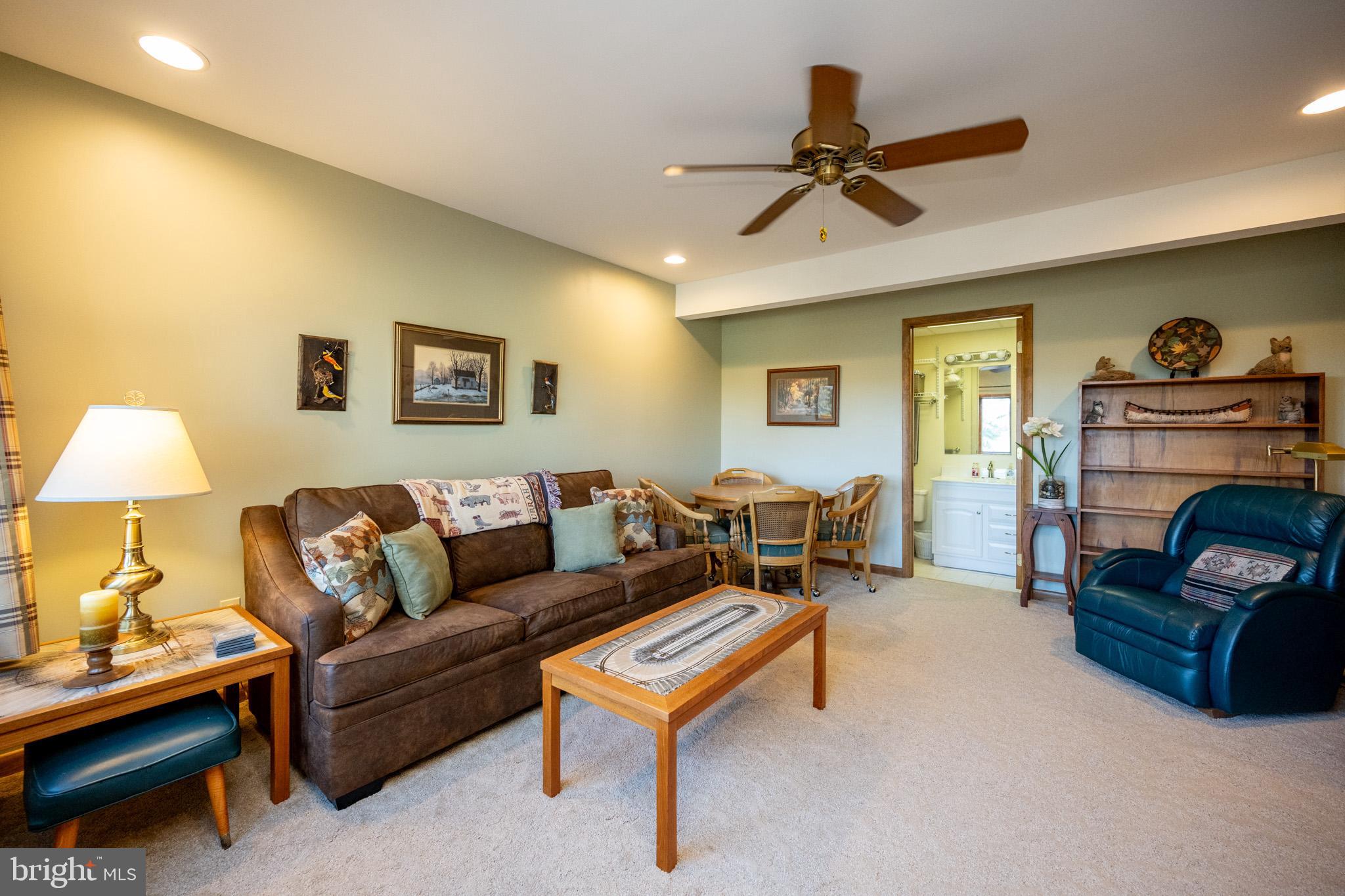 59 Glenview Road Swanton, MD 21561 - Photo 46 of 85 a living room with furniture and a lamp