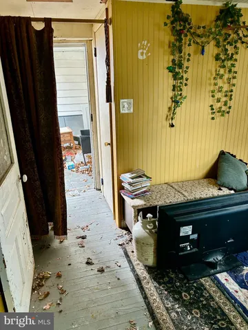 a outdoor sitting area with furniture and a potted plant